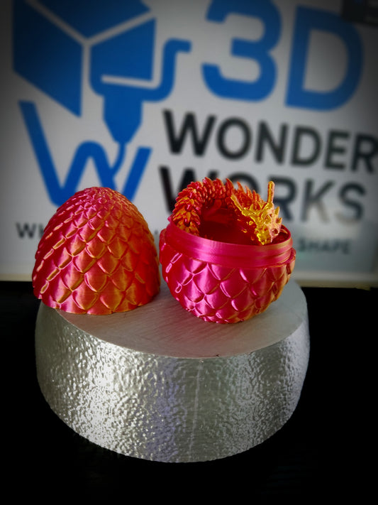 3d printed dragon with an egg.
